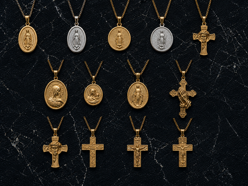 Gold crucifix pendant with the figure of Christ on a slim cross, close detail