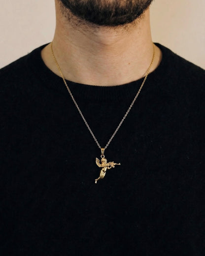 Man wearing a gold cherub necklace on a 50cm chain over a black t-shirt