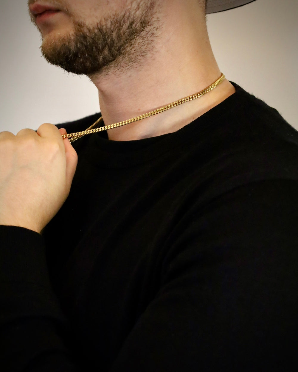 Man wearing a 4mm 18k gold plated curb Cuban link chain, close detail