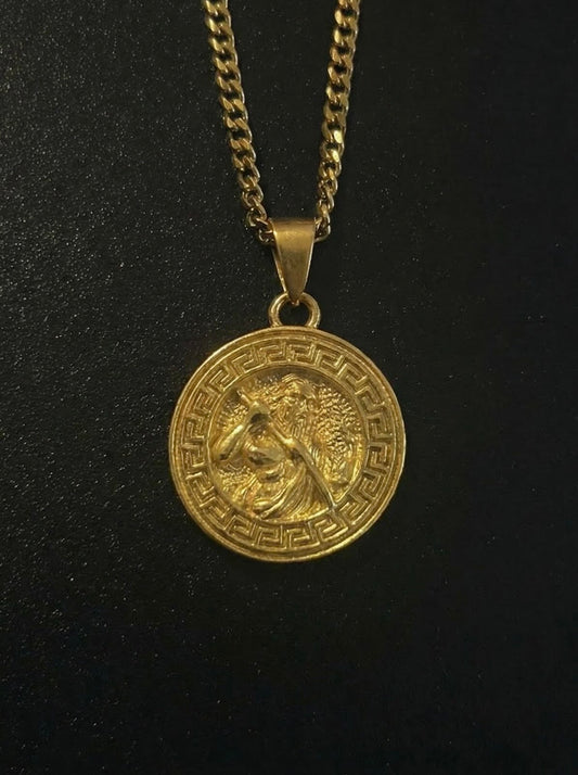 Gold Greek Zeus pendant with a bearded Zeus figure and Greek key border, close detail