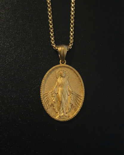 Gold Holy Mary Miraculous Medal pendant with Mary standing, arms open and rays of light, close detail