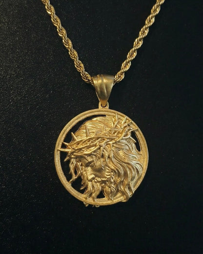 Gold Jesus head medallion pendant with the face of Christ in profile and a cut-out crown of thorns ring, close detail