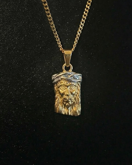 Gold Jesus head pendant with a 3D face of Christ and a silver-tone crown of thorns, close detail