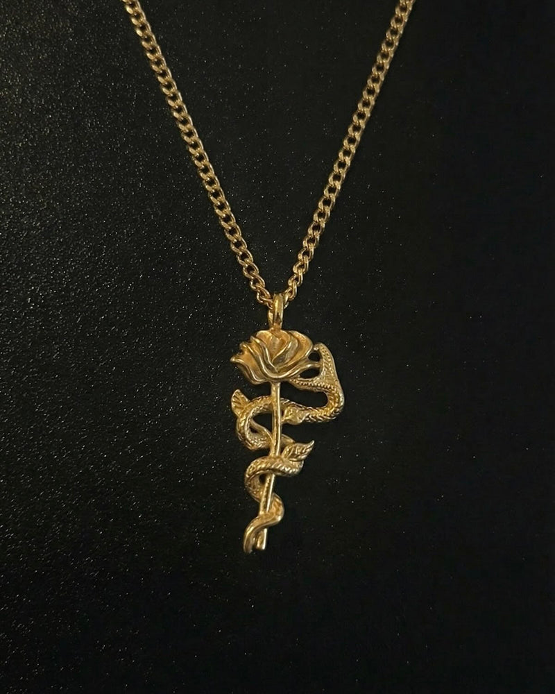 Gold snake rose pendant with a serpent coiled around a long-stemmed rose, close detail